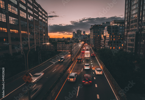 traffic in the city sunset cars sky lights brooklyn new york buildings reflections 