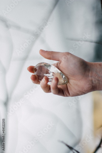 people hold a crystal