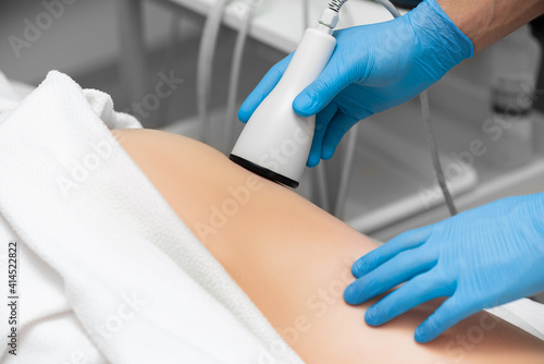 Anti-cellulite massage with ultrasound in a modern beauty parlor