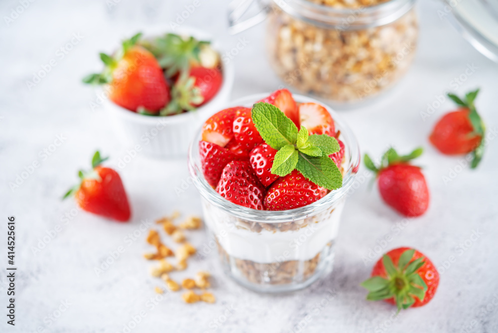Strawberry Greek yogurt granola parfait in a glass Strawberry Greek yogurt granola parfait in a glass