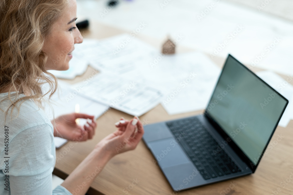 Woman working in office, making video call Woman working in office, making video call