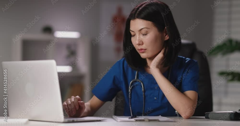 Doctor doing research on a laptop, looking for information on the internet. Medical professional working on self-isolation 4k footage Doctor doing research on a laptop, looking for information on the internet. Medical professional working on self-isolation 4k footage