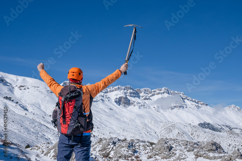 Peaks of mountains and immortalization of memories for the successful climber photo