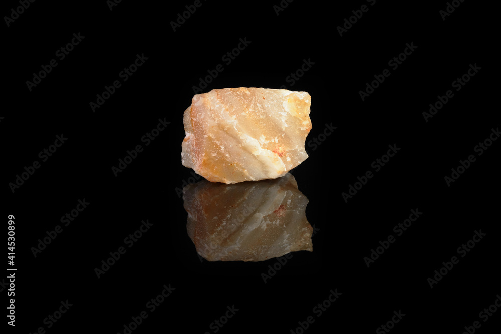 Agate-perelift from Shaytanka deposit, Middle Urals, Russia on black glass background. Perelift is a local name for agate-like banded massive rock. Agate-perelift from Shaytanka deposit, Middle Urals, Russia on black glass background. Perelift is a local name for agate-like banded massive rock.