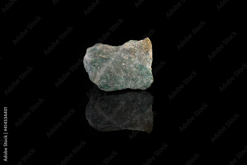 Natural rock specimens - green listvenite, listwanite mineral from Berezovsk, Ural, Russia on black glass background. Natural rock specimens - green listvenite, listwanite mineral from Berezovsk, Ural, Russia on black glass background.
