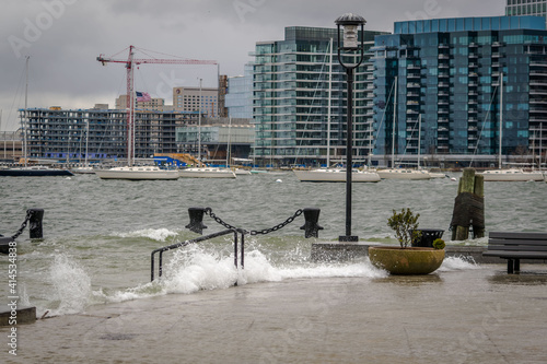 Waves churned up by a storm crash against Long Wharf in Boston