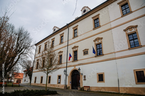 Renaissance castle with Sgraffito decorated facade, chateau with park, footpath in garden on sunny winter day, Benatky nad Jizerou, Central Bohemian, Czech Republic photo