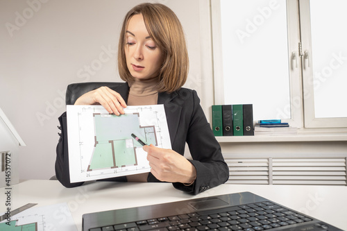 Woman architect. Girl is ho...