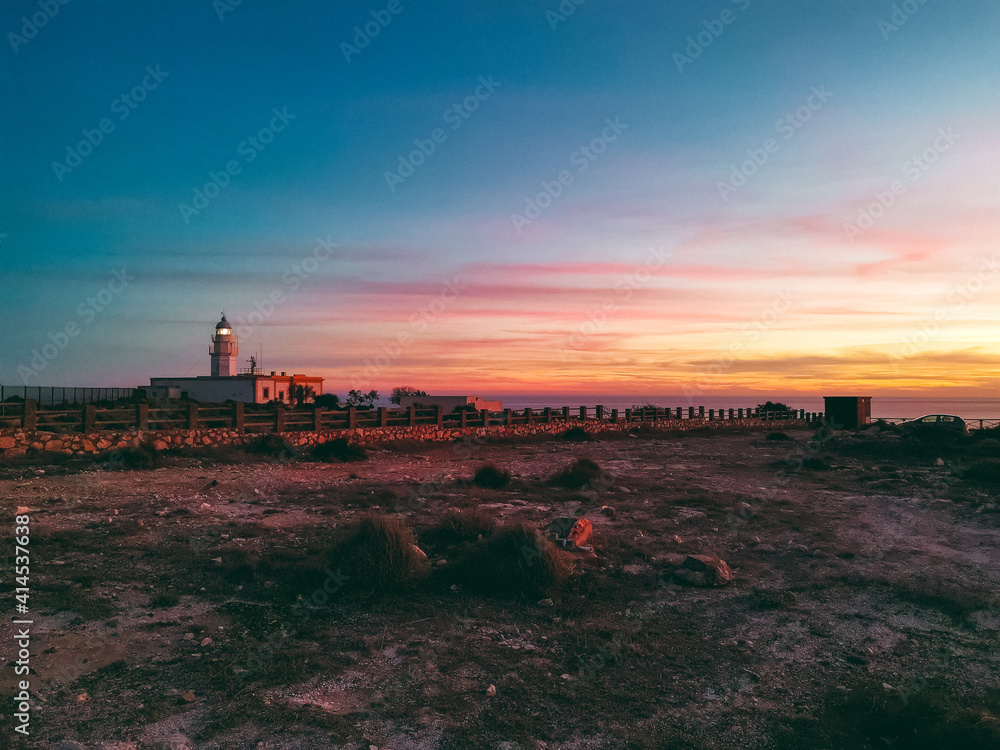 Fototapeta premium Sunset by the lighthouse