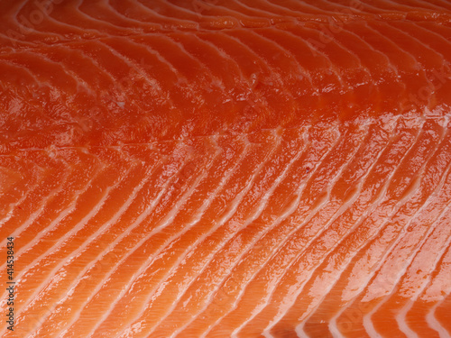 Close-up texture of fresh Norwegian red raw salmon. Top-view. Healthy food concept