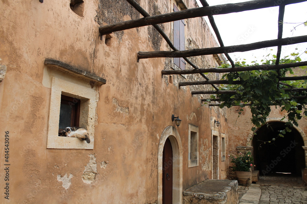 On the territory of an old Cretan monastery. Cat on window On the territory of an old Cretan monastery. Cat on window