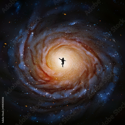 Astronaut in space. Cosmonaut silhouette. Spiral galaxy. Elements of this image furnished by NASA