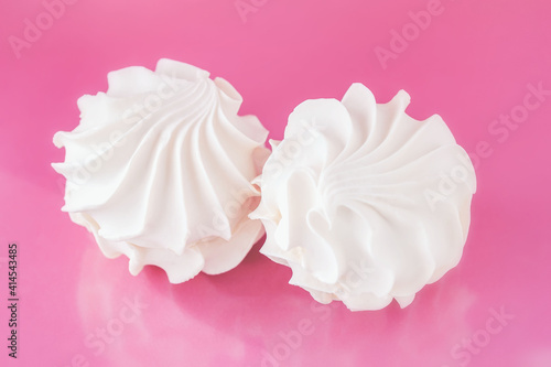 Delicate airy marshmallow close-up on a delicate pink background. Healthy fruit dessert