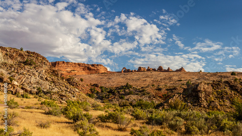 Panorama shot of red sandstone arch with monoliths and sculpturas at morning light in Arches national park in Utah, America