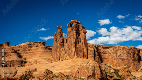 Wide shot of red sandstones Three Dossips at sunny day in Arches national park in Utah, America