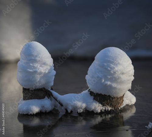 snowdrifts in the river by snowy banks