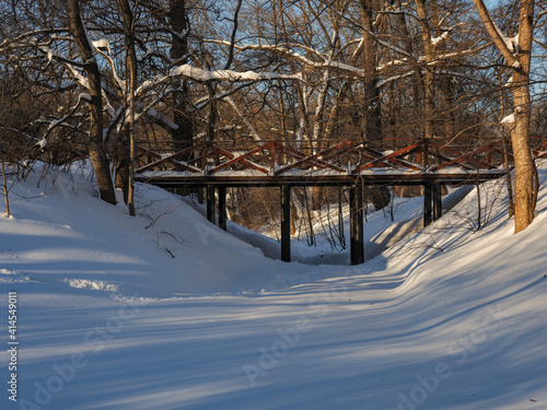 wooden bridge over snowy river