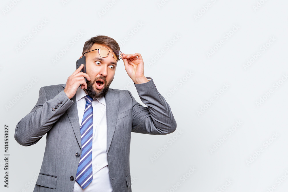Surprised, business man, business man with beard, business man on gray background. isolated Surprised, business man, business man with beard, business man on gray background. isolated