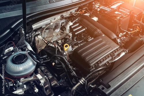 Fotografía View under car hood at modern turbocharged eco-friendly engine or motor close up