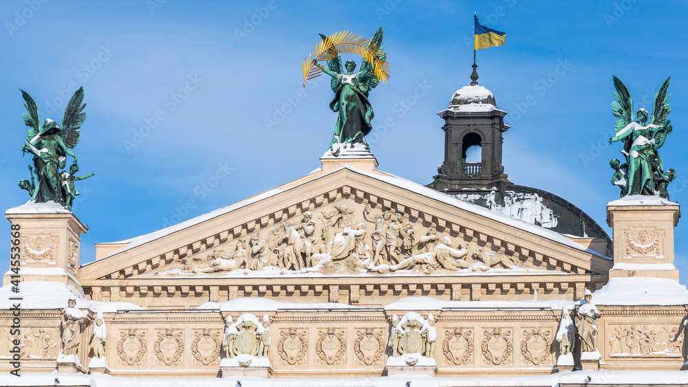 LVIV, UKRAINE - FEBRUARY 10, 2021: Lviv Theatre of Opera and Ballet, Lviv opera house, winter time. The building is crowned by large bronze statues, symbolizing Glory, Poetry and Music. LVIV, UKRAINE - FEBRUARY 10, 2021: Lviv Theatre of Opera and Ballet, Lviv opera house, winter time. The building is crowned by large bronze statues, symbolizing Glory, Poetry and Music.