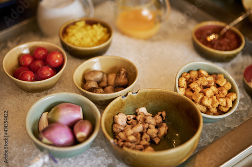 Various ingredients sorted into different ceramic bowls