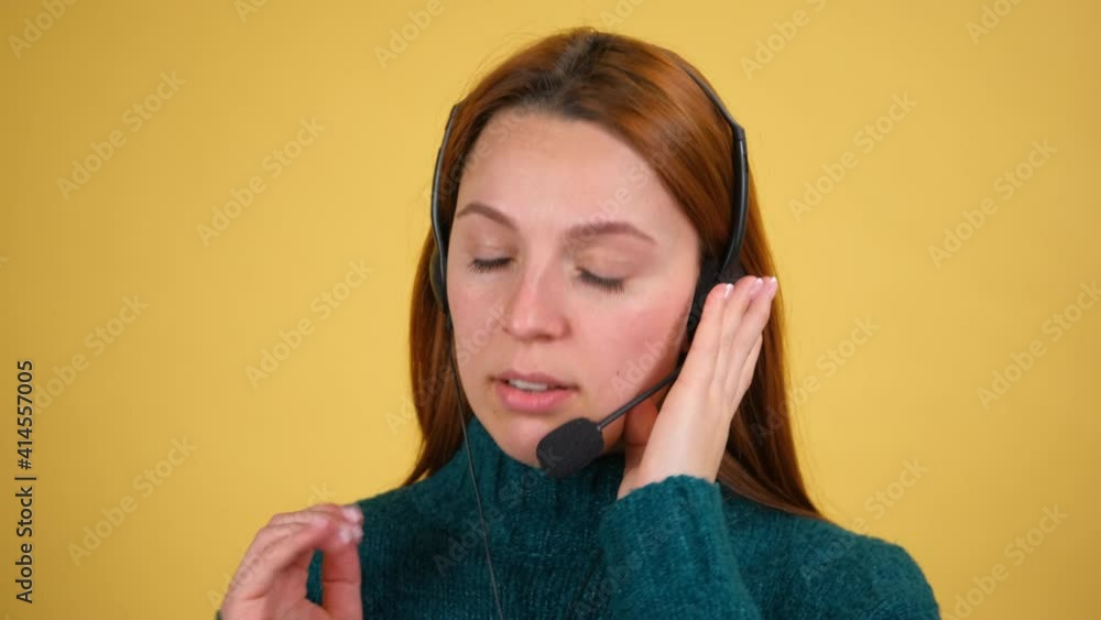 Customer support agent or call center with headset. Studio shot isolated on yellow background. Operator service business representative concept. Customer support agent or call center with headset. Studio shot isolated on yellow background. Operator service business representative concept.