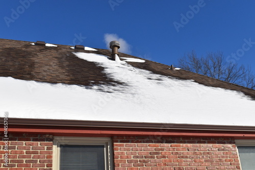 Canvas-taulu Snowy Roof with Steam Coming from a Vent