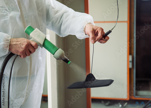 Wallpaper Mural Unrecognizable man painting with spray gun in a workshop Torontodigital.ca