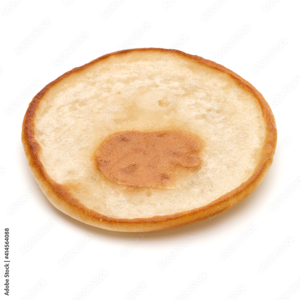 One pancake isolated on white background cutout. One pancake isolated on white background cutout.