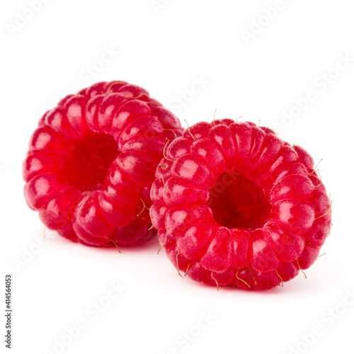 two ripe raspberries isolated on white background close up