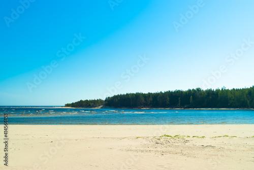 beach.in the photo, the sea shore against the blue sky