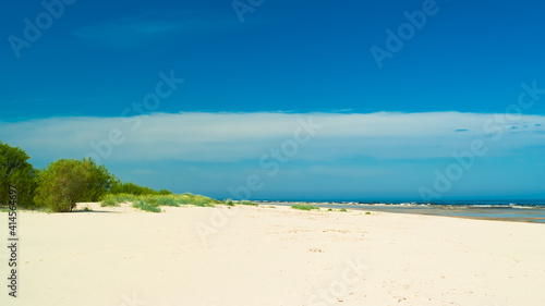 beach.in the photo  the sea shore against the blue sky