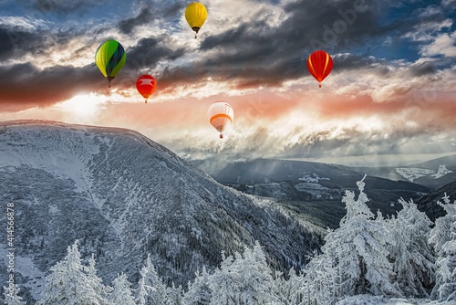 a balloon flies against the sky . winter landscape from a height of © yaalan