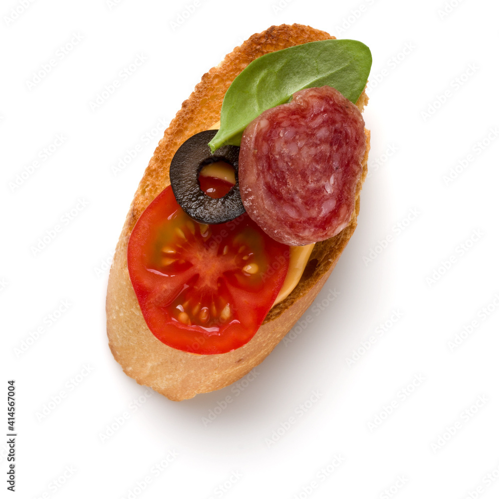 Open faced sandwich canape or crostini isolated on white background closeup. Top view. Open faced sandwich canape or crostini isolated on white background closeup. Top view.