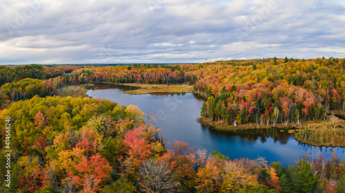 Nice autumn sunset over Scout Lake in the Hiawatha National Forest     Michigan Upper Peninsula     aerial view