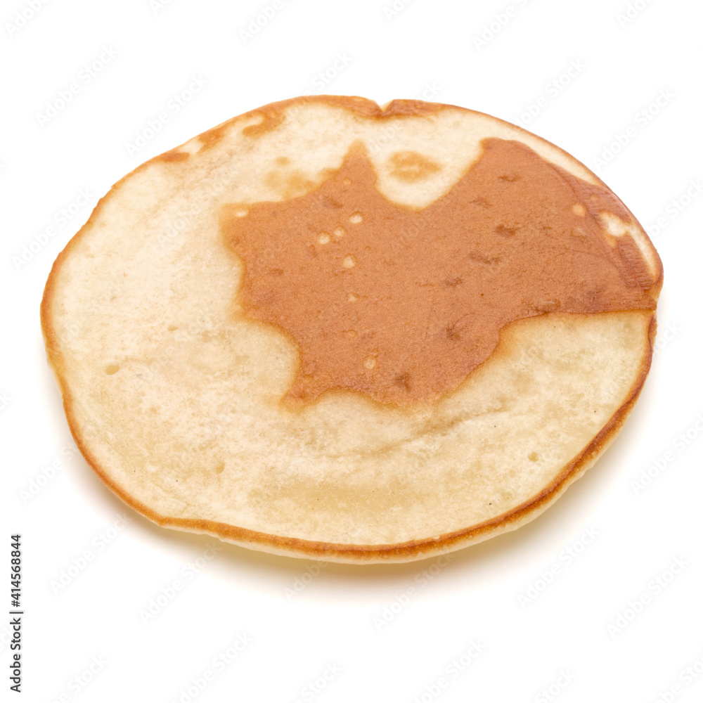 One pancake isolated on white background cutout. One pancake isolated on white background cutout.