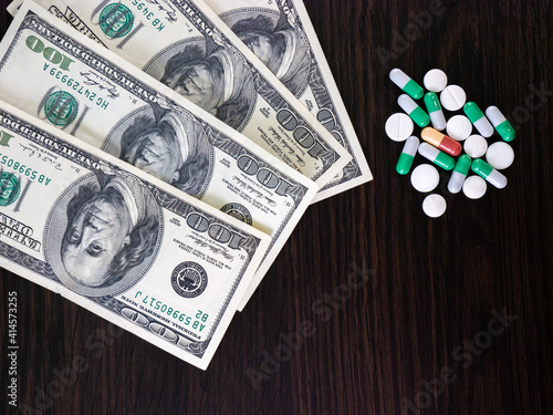 Pills and money. Medicines and dollars.