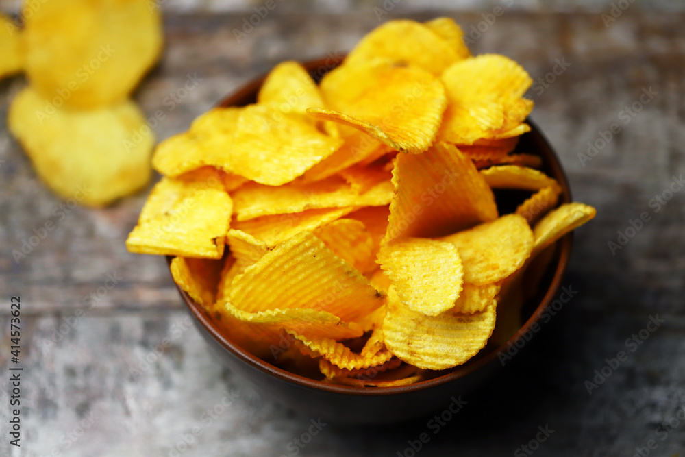 Cheese chips in a bowl. Yellow cheese chips. Cheese chips in a bowl. Yellow cheese chips.