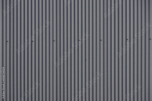 Close-up full frame image of the corrugated side paneling of a modern industrial building