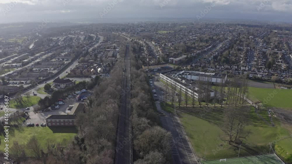 Rotating drone shot of straight railway tracks in suburban UK Watford Rotating drone shot of straight railway tracks in suburban UK Watford