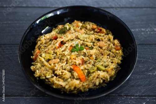 healthy plant-based food, vegan turmeric risotto with butter beans carrrots bell pepper and green beans