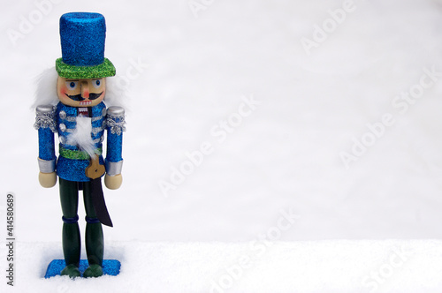 Wallpaper Mural blue toy nutcracker in white snow with copy space Torontodigital.ca