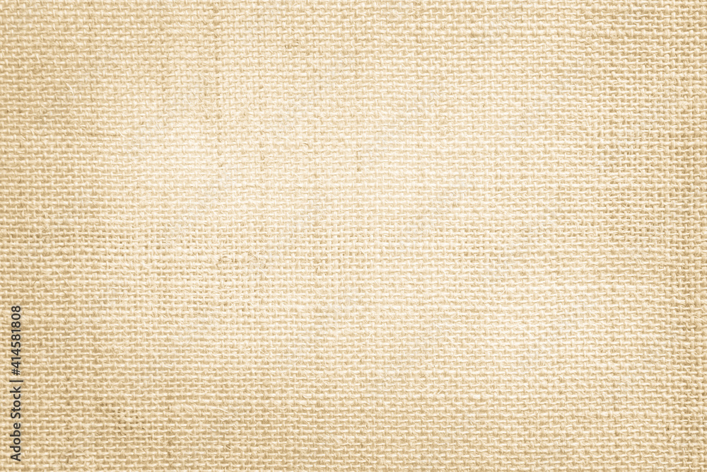 Fototapeta premium Jute hessian sackcloth canvas woven texture pattern background in light beige cream brown color blank empty