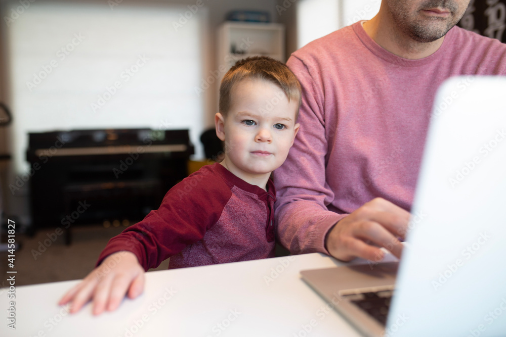 dad and son on a computer dad and son on a computer