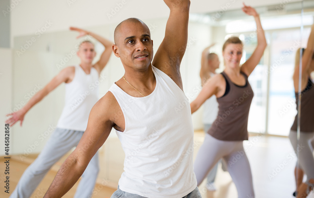 People learning swing steps at dance class