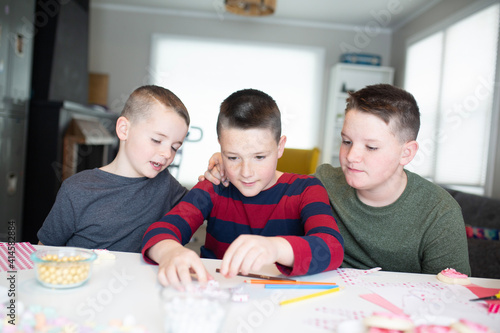 kids writing valentine's day cards