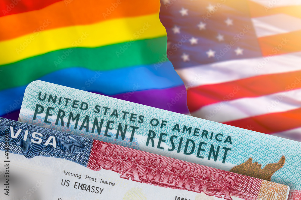 VISA United States of America. Green Card US Permanent resident. Work and  Travel documents. US Immigrant. Rainbow flag symbol gays and lesbians LGBT.  Embassy USA. Immigration Visa in passport. Stock Photo