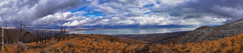 Lake Mountains Peak winter snow mountain hiking trail views via Israel Canyon towards Radio Towers, Utah Lake, Wasatch Front Rocky Mountains, Provo, Utah County. United States.