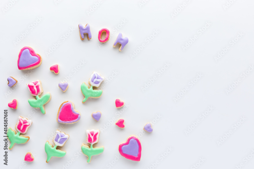 Top down view of sugar cookies in the shapes of tulips and hearts for Mother's Day. Top down view of sugar cookies in the shapes of tulips and hearts for Mother's Day.