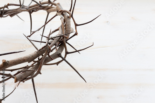 crown of thorns on white wood photo